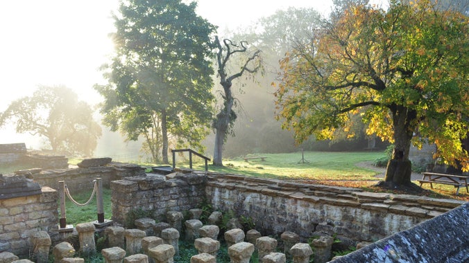 Looking over the remains of a hypocaust system at Chedworth Roman Villa during Autumn